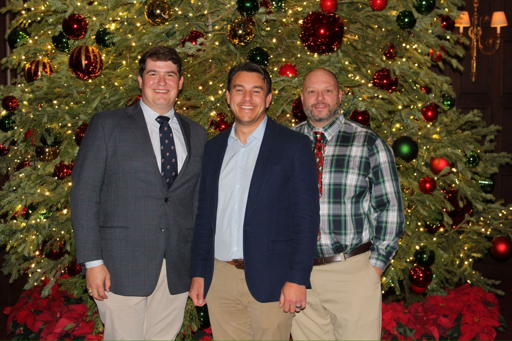 A few of the team in front of the tree