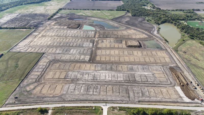 Aerial drone view of Bearpen Creek Phase 1 mass grading complete — 294 graded lots ready for utilities